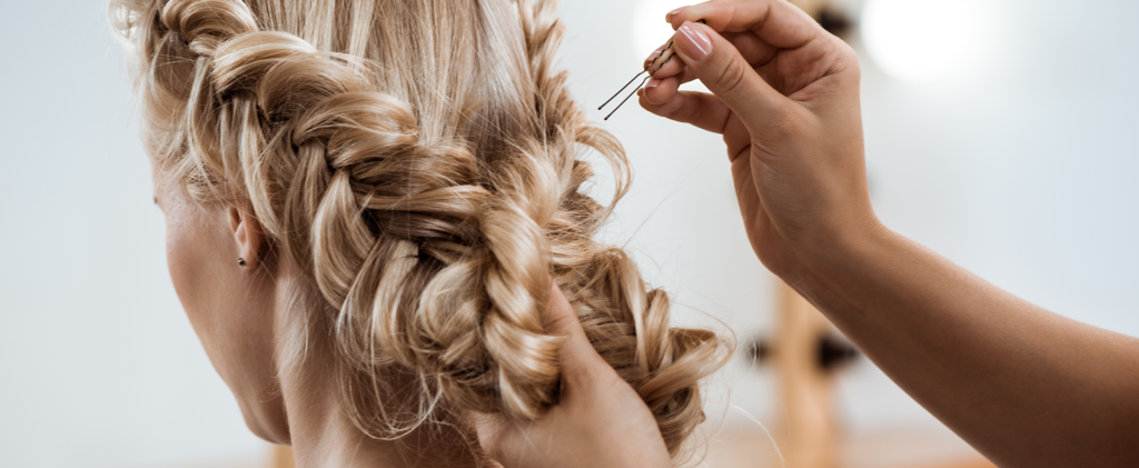 Woman braiding hair